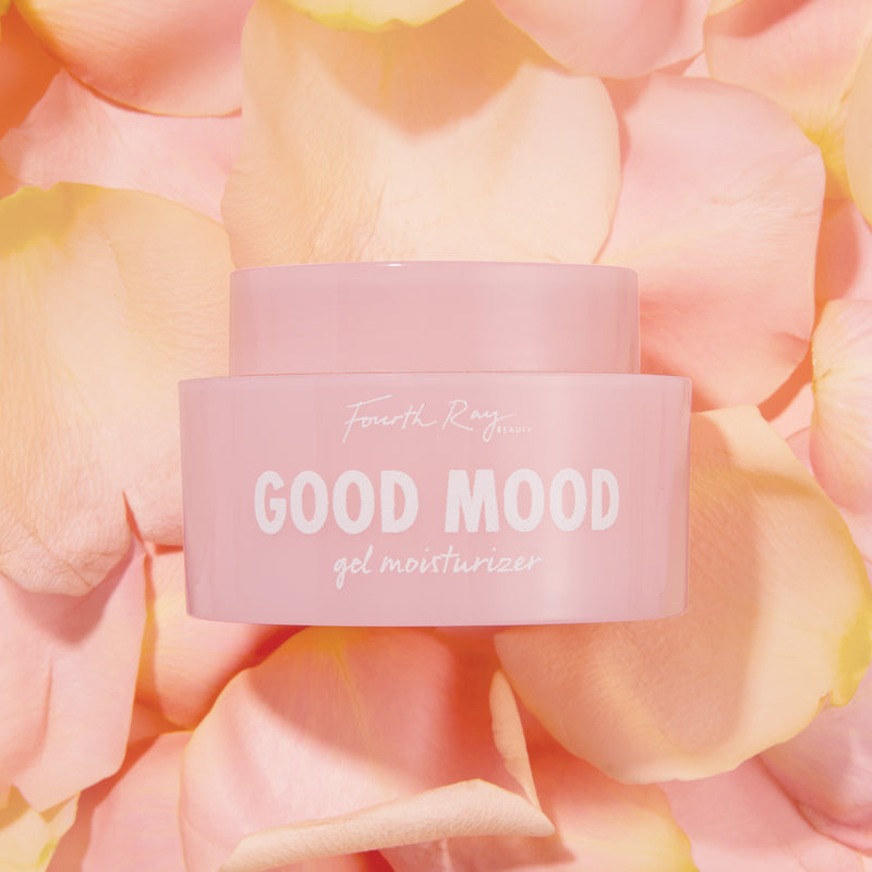 Good Mood gel moisturizer , in front of pink rose petals